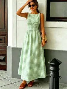 Green and white gingham maxi dress featuring a crew neck and smocked waist for summer style.