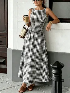 Black and white gingham sleeveless midi dress featuring shirred waist and elegant round neckline.