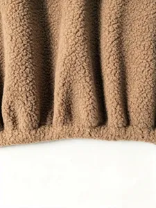 Brown sherpa fleece jacket fabric detail view showing soft textured plush material close-up.