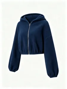 Close-up of cozy navy sherpa fleece texture, full front zipper, and elastic cuffs detail.