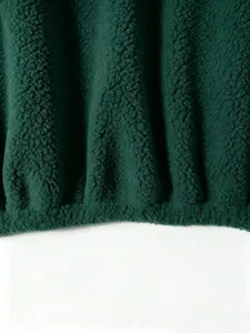 Dark green sherpa fleece fabric detail of womens autumn winter casual warm cozy outerwear top.