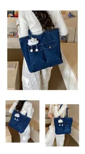 Stylish casual large capacity denim tote bag featuring dual front pockets and cloud charm.