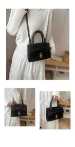 Borsa a mano minimalista da donna, elegante borsa a tracolla nera con chiusura in metallo.