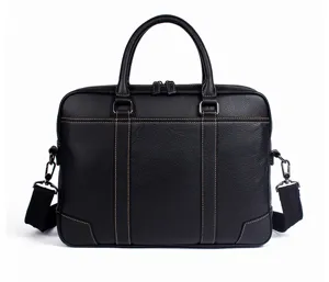 Men business leather briefcase detail view, black laptop bag with shoulder strap, durable work bag.