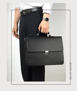 Black genuine leather business briefcase detail shot, professional men office bag with metal lock.