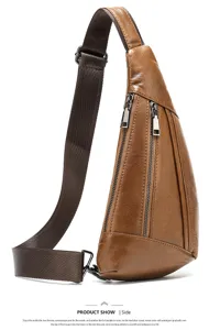 Detail shot of brown leather sling bag featuring dual vertical zippers and sturdy strap.