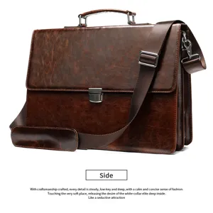 Detail view of vintage brown leather briefcase with metal lock and shoulder strap.