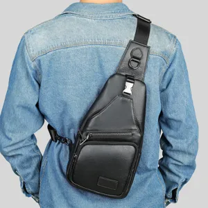 Men's leather sling bag chest pack detail view, showing multi-pocket design and strap hardware.