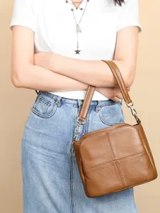 Genuine leather brown crossbody handbag for women, versatile large capacity shoulder tote bag.