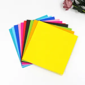 Colorful disposable paper napkins for birthday party and festive events, top view.