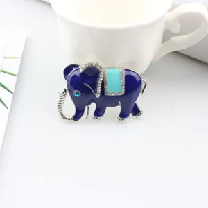 Detail view of cute blue elephant rhinestone brooch with delicate enamel and sparkling crystals.