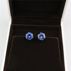 Round blue cubic zirconia stud earrings, elegant 8mm 6-prong sparkly crystal jewelry detail.