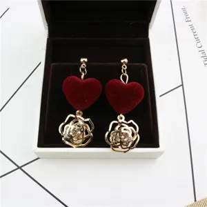 Gold-tone metal red velvet heart flower zircon drop earrings fine detailed closeup view.