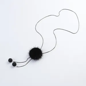 Long black mink fur ball sweater necklace with metallic chain and pendant beads for women.
