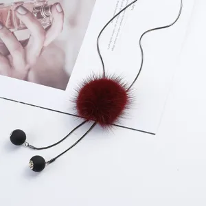 Long mink fur ball sweater chain necklace with black beads, elegant winter sweater jewelry.