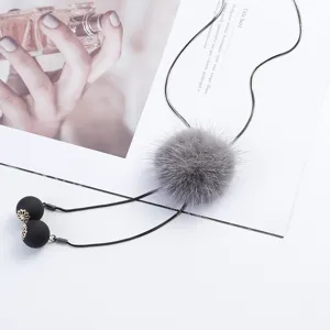 Elegant long sweater necklace featuring a grey mink fur pom-pom and black tassel beads.