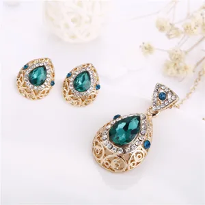 Detailed close-up view of the vintage teardrop crystal pendant necklace and earrings set.