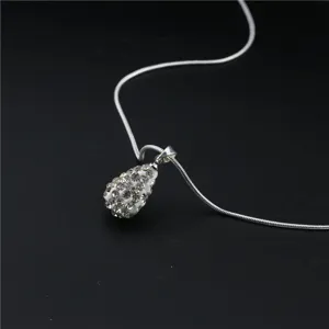 Detailed view of silver tone chain necklace with crystal rhinestone paved teardrop pendant fashion