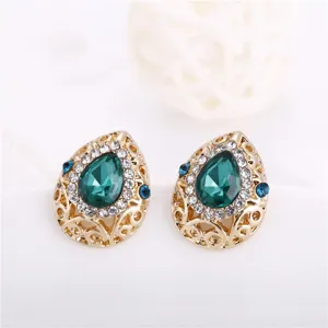 Vintage teardrop crystal earrings with green center stone and gold alloy hollow frame design.