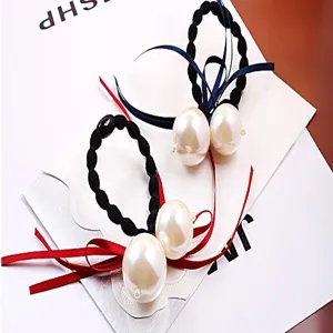 Chouchous de style coreen avec de grandes perles et des rubans colores, accessoire chic.