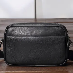 Black genuine leather crossbody bag for men, stylish casual shoulder bag with zipper pocket.