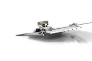 Stainless steel truffle shaver detail view, precision metal blade and adjustable knob for kitchen.
