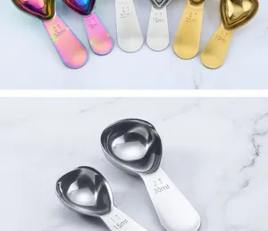 Stainless steel heart shaped measuring spoons set detail view showing clear scale markings.