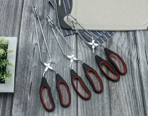 Stainless steel scissor food tongs for kitchen, barbecue, steak, and bread gripping tool.