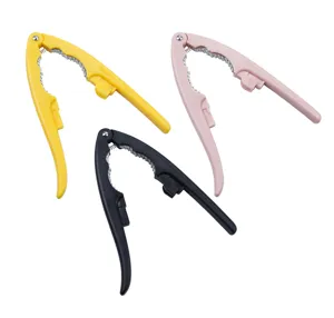 Close-up view of durable zinc alloy nutcrackers in yellow, pink and black for kitchen use.