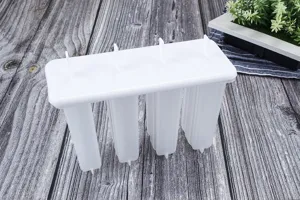 White 4-cavity ice pop mold with lid, perfect for making DIY homemade popsicles in summer.