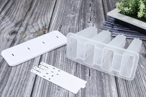 4-cavity DIY plastic popsicle mold with lid and sticks, perfect for homemade summer treats.