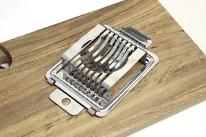 Stainless steel egg slicer kitchen tool for slicing boiled eggs quickly and evenly.