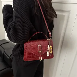 Wine red crocodile pattern leather crossbody handbag, stylish casual commuter shoulder bag.