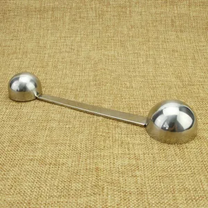 Stainless steel double-ended coffee scoop measuring spoon for kitchen and baking use.
