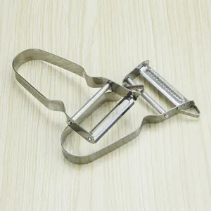 Stainless steel multi-functional fruit and vegetable peeler and shredder kitchen tool.
