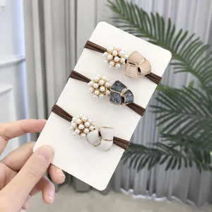 Pearl flower hair ties set, elegant elastic rubber bands, minimalist hair accessories for women.