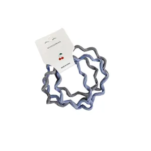 Set van golvende haarelastiekjes in blauw en grijs, elastische bandjes met verpakking.