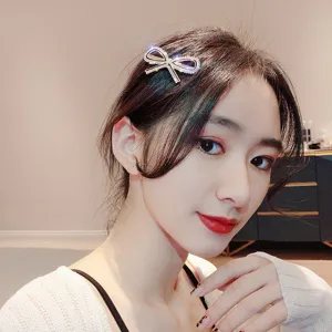 Rhinestone bow hair clip for women, sparkling crystal hairpin, Korean style metal hair accessories.