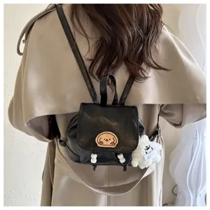 Stylish black mini backpack for women, trendy cute dog patch schoolbag for daily commute.