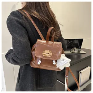 Stylish vintage brown PU leather mini backpack with cute embroidery and bear pendant for women.