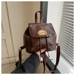 Brown PU leather mini backpack for women, vintage casual school bookbag with cute dog patch.