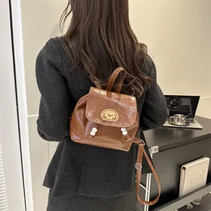 Stylish brown leather mini backpack for women, trendy cute dog patch campus casual book bag.