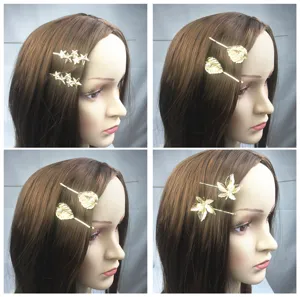 Detailed close-up shot of gold alloy hair clips featuring cute star and leaf designs.