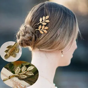 Detail shot of the elegant gold leaf hair clip, showing intricate leaf texture and sturdy clip.