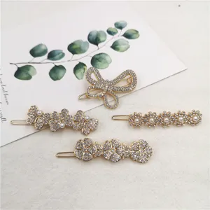 Detailed view of elegant gold rhinestone and pearl hair clips set, perfect for daily styling.