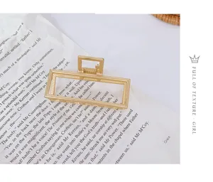 Elegant metal hair claw clip with geometric rectangular design for women chic updo styling.