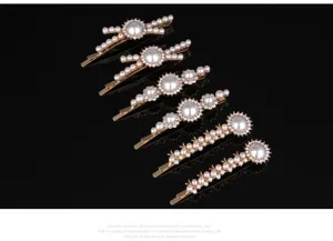 Detailed view of exquisite pearl and rhinestone hair clips set, elegant gold bobby pins.