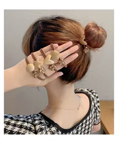 Korean style cute hair ties and bracelets set with geometric rhinestone charms for women.