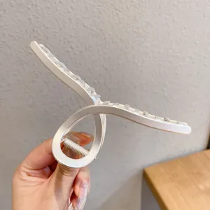 Minimalist geometric metal hair claw clip, matte white finish, strong spring for secure hold.