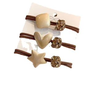 Minimalist geometric hair ties set with crystal beads and brown elastic ropes for daily use.